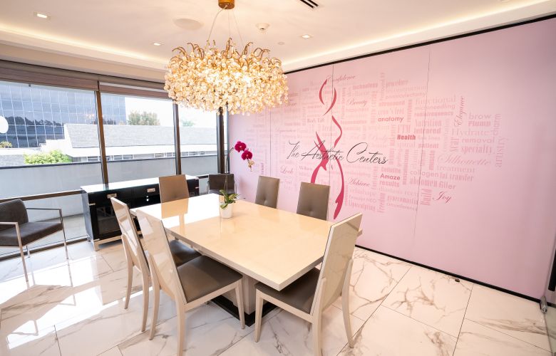 Stylish dining area with chandelier and decor.